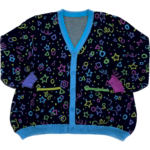 Roller Rink A multicolored cardigan laying flat with the front facing the camera. The cardigan is bright pink,. purple, yellow, green and blue stars, circles, triangles, squares and confetti on a black background.