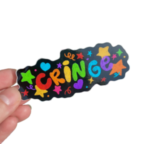 hand holding a playful black sticker with colorful heart, star and confetti around the word "cringe"