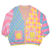 Pastel multicolored cardigan with smiley face pockets on a white background. Cardigan sleeves are alternating color stripes with the front panels being multicolored stars, and a diamond checkered pattern with happy face pockets.