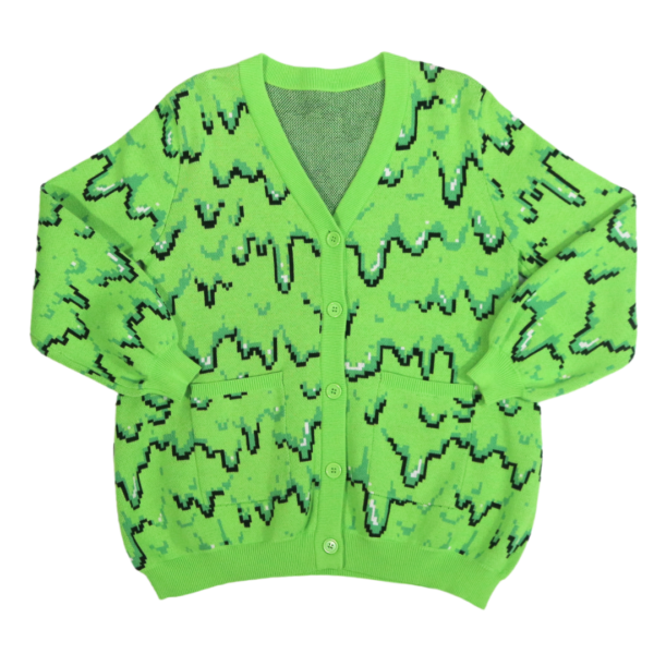 Green cardigan with black and dark green pixel slime pattern laid flat with the front facing the camera.