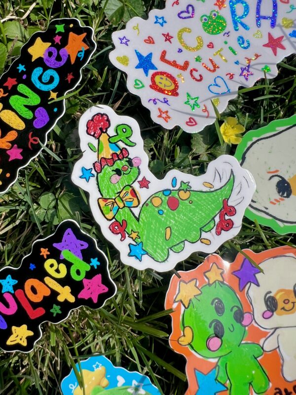 Collection of colorful stickers on a grass background