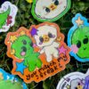 Colorful stickers with cartoon characters on a grass background