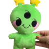 hand holding medium sized cheerful alien plush. Alien has three eyes, pink round cheeks, two yellow star antennae