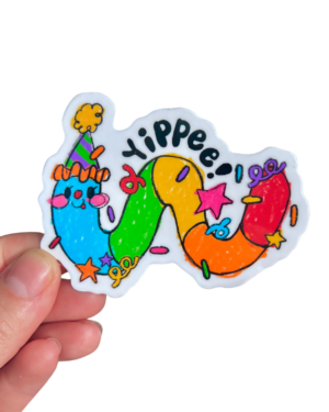 hand holding a multi colored worm wearing a party hat with "Yippee" and confetti on top