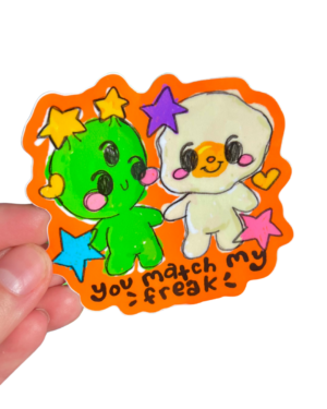 Colorful stickers with an alien cartoon character and egg characters held by a hand on a clear background