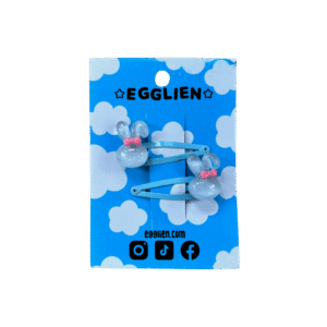 A pair of blue bunny cabochon with a pink bow on blue hairclips both on backing card that reads "Egglien"