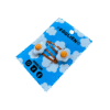 A pair of fried egg cabochons on orange hairclips both on a blue backing card that reads "Egglien"