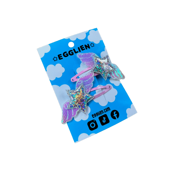 Pink Holographic hair clip side A pair of holographic stars with wings on pink hairclips both on a blue backing card that reads "Egglien".