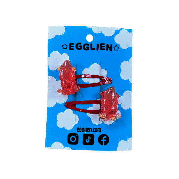 squid red hair clip front A pair of red squid cabochons on red hairclips both on a blue backing card that reads "Egglien"