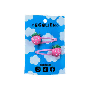 pink strawberry hair clips front A pair of pink strawberry cabochons on pink hairclips both on a blue backing card that reads "Egglien"