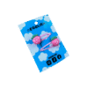 A pair of pink strawberry cabochons on pink hairclips both on a blue backing card that reads "Egglien"